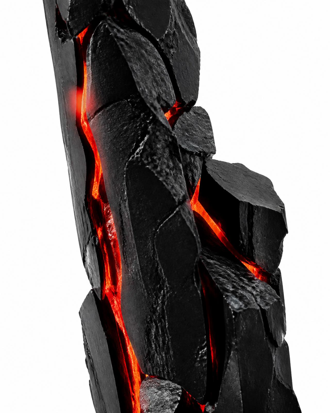 a black monolith fractured open with molten red seams